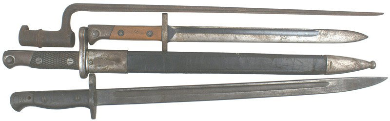 Lot of 4 bayonets British Italian Mauser etc: D-110 Lot of 4: (1) British Enfield M1907. 17" darkened blade marked "SANDERS", "1907", etc. No scabbard. (2) Italian Caracano M1891. 11 ¾" blade (bluing in fuller) has dark spotting on tip. No scabb