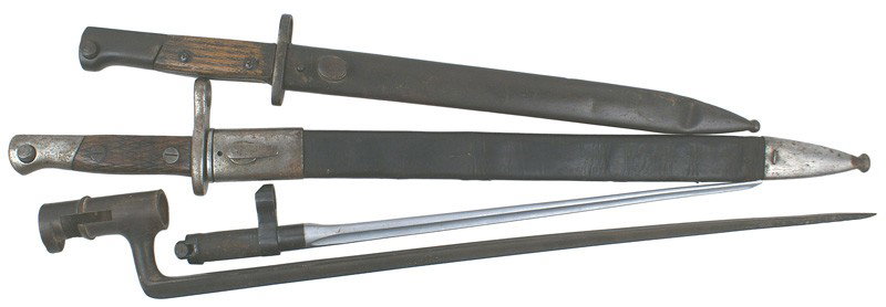 Lot of 4 bayonets Mauser M1893 Soviet etc: D-111 Lot of 4 bayonets. (1) Spanish Mauser M1893. Steel pommel and crossguard/muzzle ring with wood grips. 15 5/8" polished blade, numbered "93671". Steel throat and tip on a black leather scabbard. 