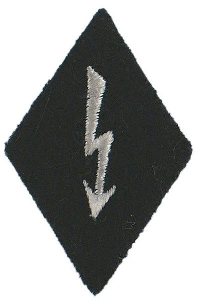 German WWII EM Signal Personnel arm badge: H-83 EM Signal Personnel Specialty arm badge. Embroidered silver-gray lightning bolt on a black "diamond". II