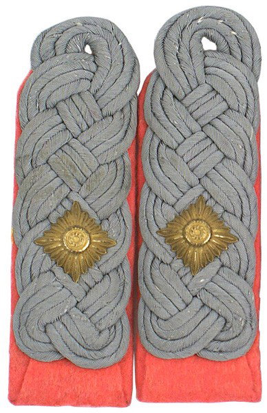 German WWII shoulder boards Panzer: H-143 Panzer rank of Oberstleutnant shoulder boards. Gilt metal "pip" on intertwined silver-gray cords on pink underlay. Sew-in. Pair. II