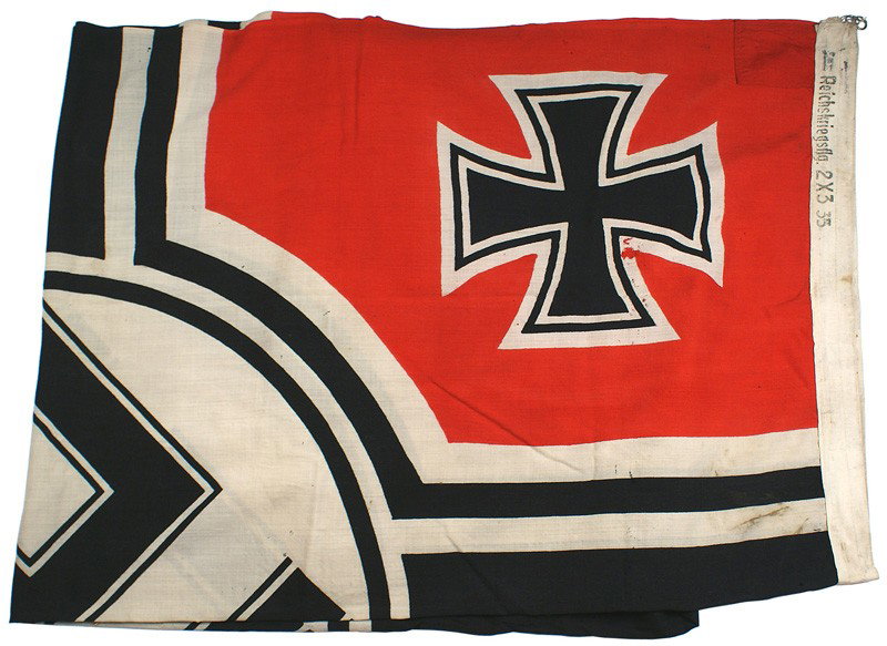 German WWII Navy Kriegsflagge flag: H-208 Navy "Kriegsflagge". Border marked as above and with size "…2 x 3.55" (79" x 140"). With a metal suspension ring sewn in two corners. Some minor mothing. About II