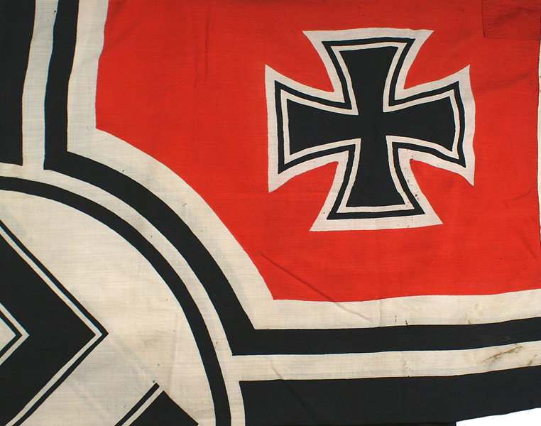 German WWII Navy Kriegsflagge flag: H-209 Navy "Kriegsflagge" - reinforced border is ink stamped with name of maker, eagle/swastika and "M" and "LOH KR-FL. 150 X 250" (59" X 98"). With large rope loops. One very small tear at extreme ed