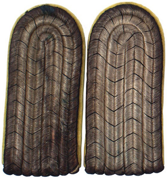 German WWI Prussian officer shoulder boards: H-240 Prussian officer shoulder boards. Silver bullion with black "V's" - on lemon-yellow underlay. One nip on edge and one has two nips on the reverse. Possibly Dragoon or a Corps color. II