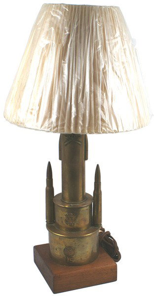Souvenir U.S. WWI trench art table lamp: H-266 Souvenir WWI "trench art" table lamp. 10 ¾" brass shell with side-mounted bullet heads and crossed rifles with "326". Above is mounted on a double tier of the bottom sections of artillery casin