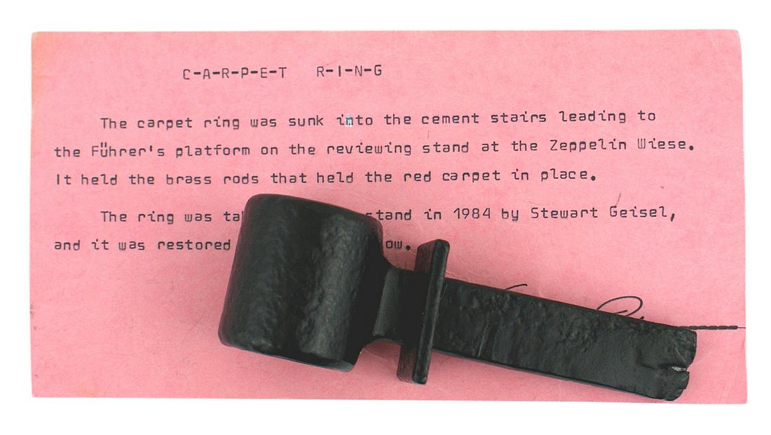German WWII era Nurnberg stadium carpet ring: A-134 Third-Reich era Nurnberg stadium carpet ring. Taken from the cement stairs leading to the Fuhrer's platform on the reviewing stand at the Zeppelin Wiese. Two of these rings held a brass rod whic