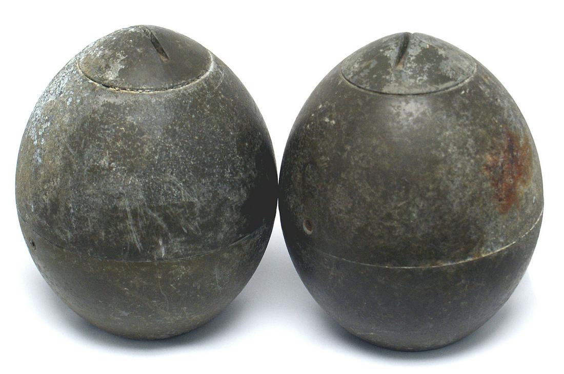 Lot of 2 unknown projectile heads: M-074 Lot of 2 unknown projectile heads. Egg shaped with a non-magnetic pointed screw top. Weight 5.5 lbs. each. Appears to be made in two sections. OD finish. Threaded base interior. II