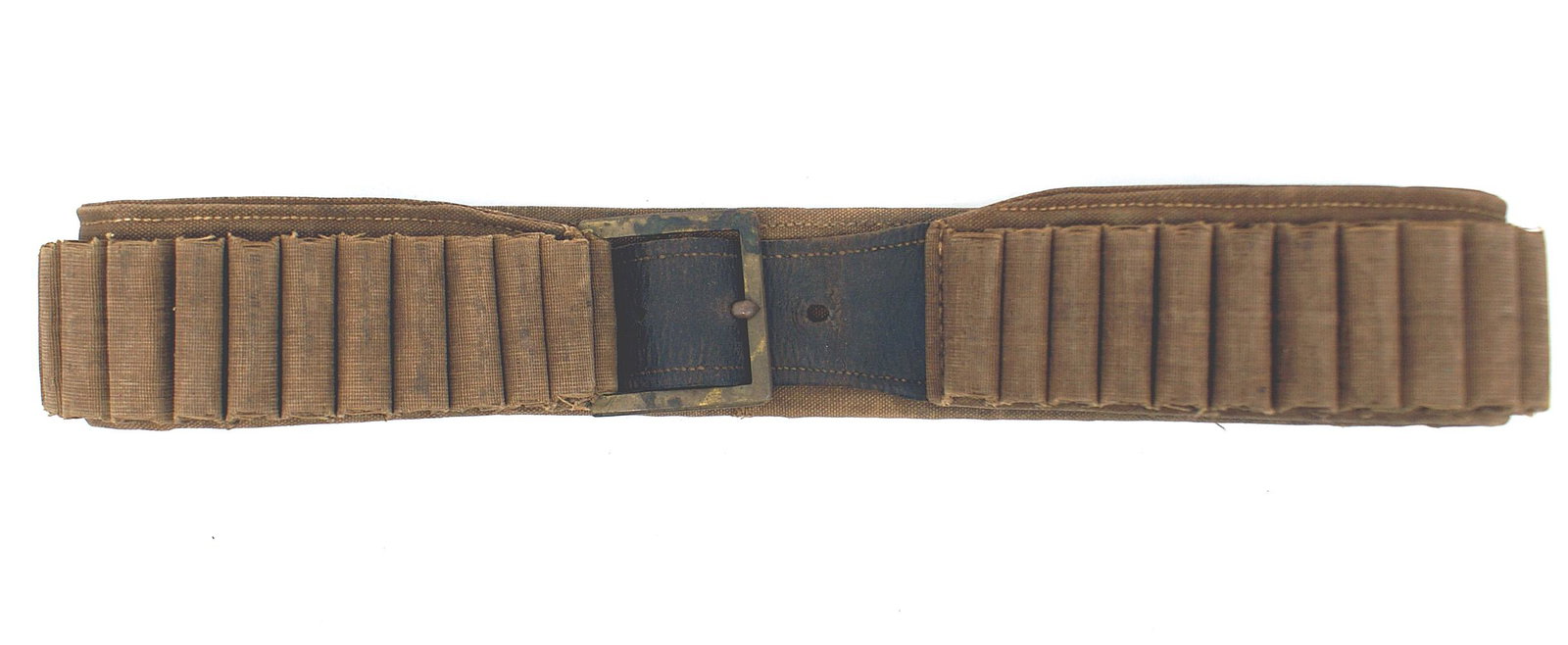 US Pattern 1876 cartridge belt: K-117 US Pattern 1876 cartridge belt. 2" wide drab colored canvas covering hemmed along the bottom edge. Fifty-four, 2" cotton webbing loops are sewn to the belt - allowing for a 2 3/8" x 2 1/8" brass