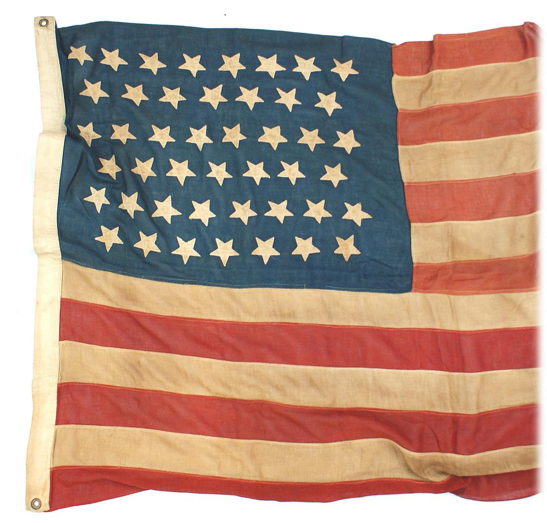 American 45-star flag Spanish American War Era: K-177 American 45-star flag. Spanish-American War Era. Individually sewn age darkened stripes and white stars on the blue canton. 4' x 6'. Corners were reinforced, probably to prevent tattering. Brass