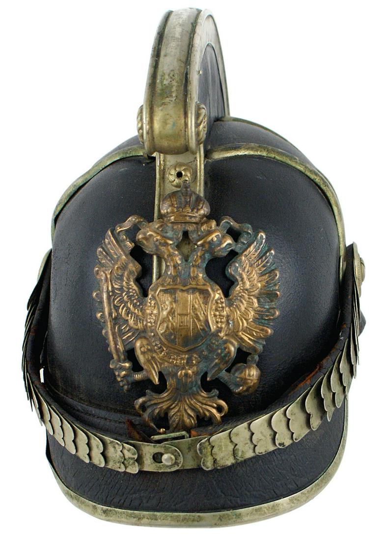 19th Century Austrian fire department helmet: E-001 Scarce 19 century Austrian fire department helmet. "Dragon" style black leather "pickelhaube" type with an age toned silver trimmed 2 1/2" leather comb, silvered chinscales, visor trim and two "