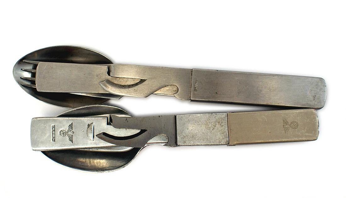 2 German WWII mess kit eating utensils: N-002 Lot of 2 German WWII mess kit eating utensils. Both sets consist of a spoon, fork, knife, can opener and metal sleeve. Both stamped with an eagle/swastika. The aluminum set is also dated "43" an
