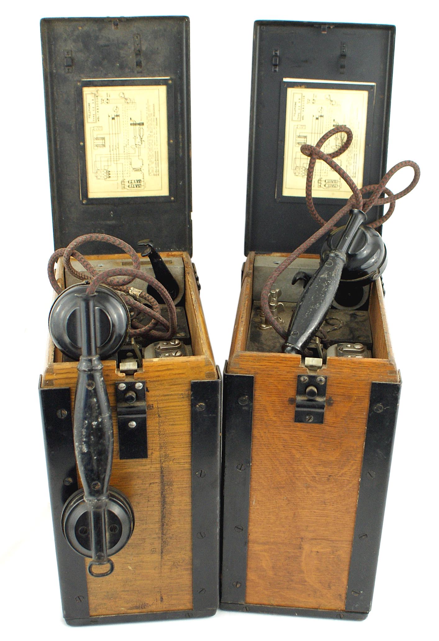 Pair of US WWI Type EE35 field telephones: N-036 Pair of US WWI (Type EE-35) field telephones. 5 3/8" x 8 7/8" x 10 3/8" metal framed cases with a hinged top lid. Speaker phone and all components are housed within each case. Total weight 41 lb