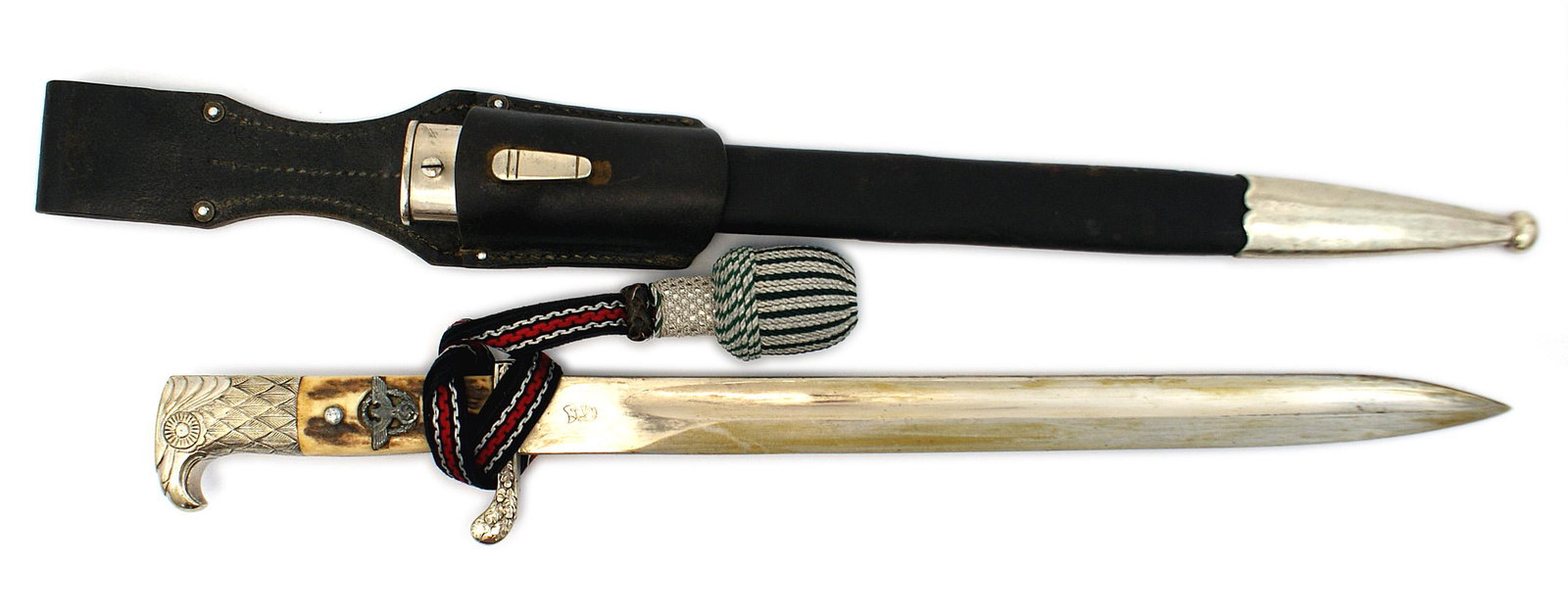 German WWII Police dress sidearm bayonet: D-001 German Third-Reich Police dress sidearm "bayonet". Nickeled defined eagle head pommel and oak leaf decorated crossguard (numbered "S.B.3490"). Unusual in that the police insignia was added after