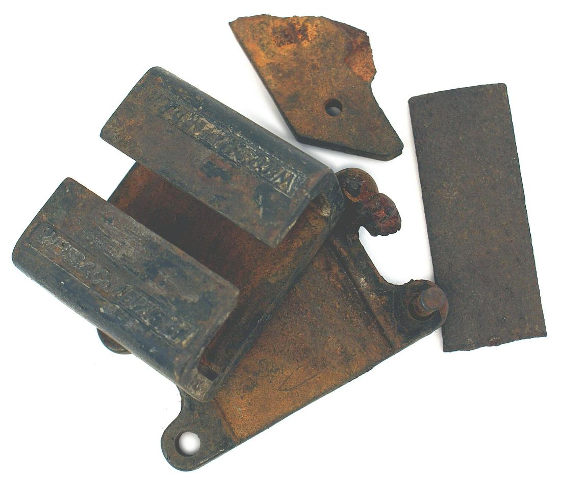 Lighting fixture outside Hitler Fuhrerbau in Munich: A-012 Several metal components from a lighting fixture outside the "Fuhrerbau" in Munich. One bracket is maker marked "WEISS & CO. LEIPZIG oI" and "WECO DAMPFER D.R.P." From the Donald G. Brownlow Col