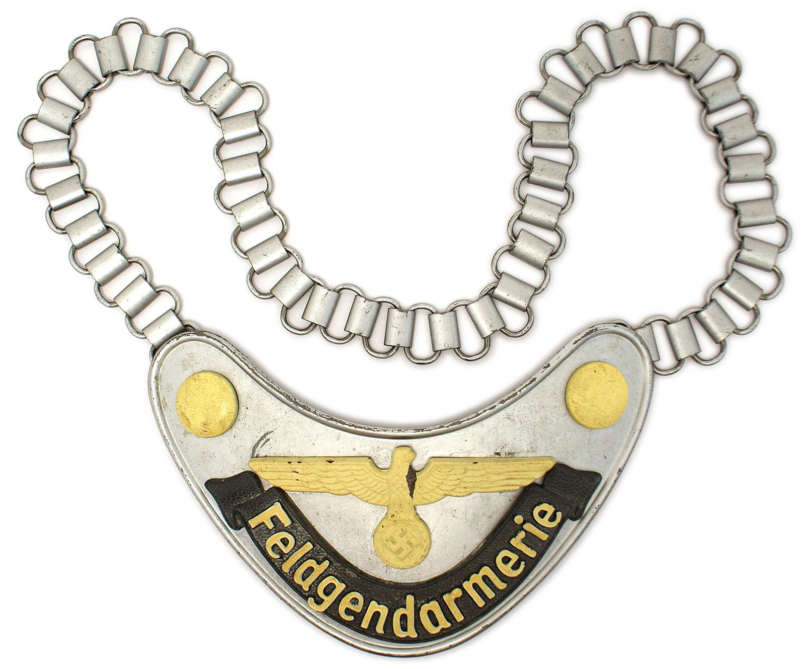 German WWII Military Field Police gorget: H-049 German WWII Military Field Police gorget. 6 1/2" x 3" dull silver-gray crescent with applied luminous buttons, large eagle/swastika and ribbon with "Feldgendarmerie". Reverse has a pressed cardb