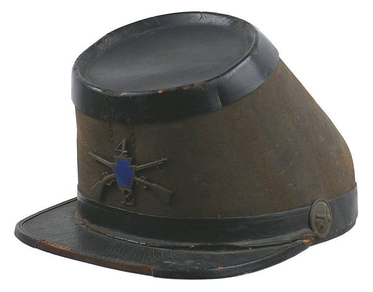 U.S. Civil War era beaverskin shako: K-16 Civil War era beaverskin shako. Similar to the 1850's French imports, but with a more radical forward slant. Black leather top, band around base and visor. One of the crossed cannons bosses, whil