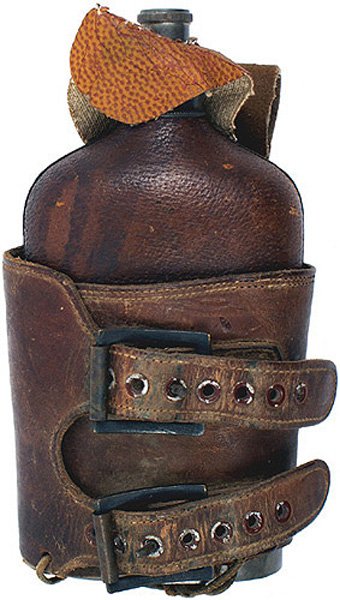 Spanish-American War Period glass flask: K-97 Spanish-American War Period leather covered glass flask. With a pewter cup base. Pewter screw-on cap is marked "OLRY'S FLASK - NEWTON'S PAT. NOV. 29, 81 - OLRY & CO. PHILADA". Military double-buc