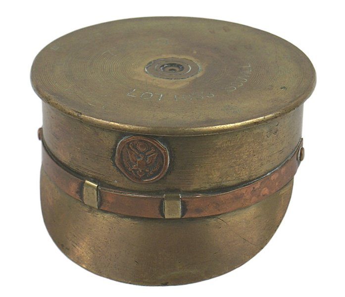 Brass U.S. WWI peaked cap ashtray: G-9 Brass U.S. WWI peaked cap ashtray. Base of a 75mm was cut from the shell, shaped with a visor and a copper chinstrap and the face of an eagle button added. Well made. II