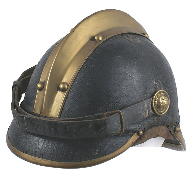 Early German Fire helmet modified pickelhaube: E-32 Early German Fire helmet, modified from a pickelhaube. 61/2" black leather body with brass edged visors and a full brass comb. Wide leather chinstrap with brass lion head bosses. Underside of fro