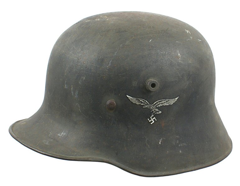 German WWII Luftwaffe Transition helmet: E-41 Luftwaffe M-1918 double decal Transition helmet. Eagle/swastika 100%, National Colors decal has several chips on the borders. Darkened patina on body with green brush strokes visible - possibly a