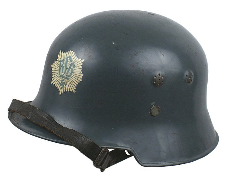 German WWII RLB civil transition helmet: E-47 RLB civil "duck bill" transition helmet. Double relief "punched" air vents and thee liner band rivets. Gray finish with "RLB" and a swastika on a starburst decal - on front. Eight leather tongue 