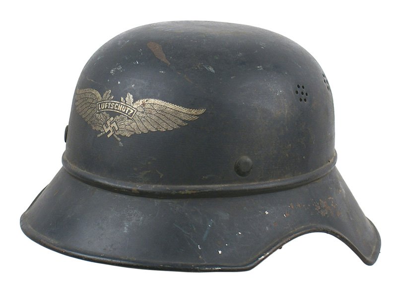 German WWII Luftschutz Air Defense helmet: E-48 Luftschutz (Air Defense) helmet. "Gladiator" type three-piece. Dark blue finish (shows scattered wear) with large winged swastika/"Luftschutz" decal. Inside back rim is marked with size and Lufts
