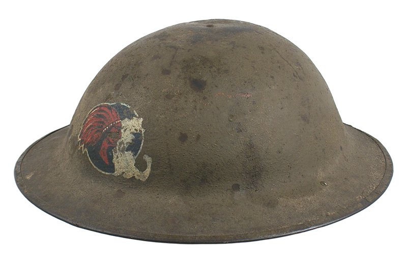 U.S. WWI 101st Field Artillery doughboy helmet: E-59 WWI 101st Field Artillery "doughboy" helmet. OD "sand finish" with a painted Indian head/map of New England. Chinstrap is split and with loose liner. II
