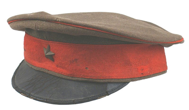 Japanese WWII Army officer peaked cap: E-130 Army officer's peaked service cap. OD body with a red band and piping. Age-toned brass star on front. Age lines and some wear on edge of black leather brim. Black leather sweatband shows wear an