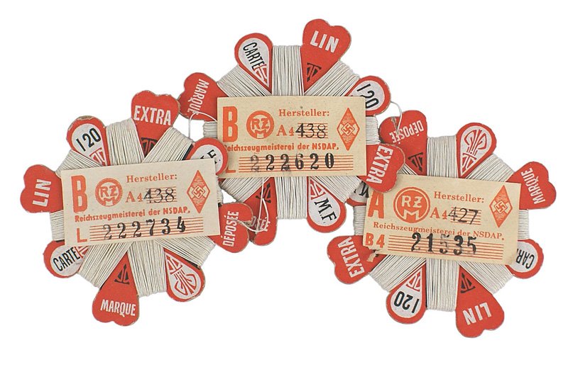 German WWII unused thread cards HJ RZM: F-99 Three unused thread cards. Maker marked, each with 120 cm of wound white thread and an HJ "RZM" label. I