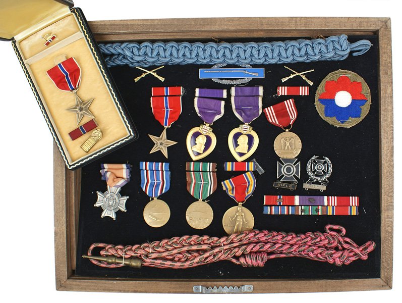 Lot of U.S. WWII Bronze Stars Purple Hearts: B-223 Lot of U.S. WWII awards: (1) Two Bronze Stars, one case, both engraved - "JOHN J. MILLER". (2) Two Purple Heart's, one engraved as above with a linear underline. (3) Good Conduct. (4) New York S