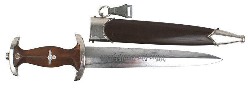 German WWII SA dagger: D-2 SA dagger - small chip in the front left corner of the rosewood grip and on the reverse side. Some minute "dimples" on crossguard. Clean blade with motto and marked "RZM M7/85". 99% original finis