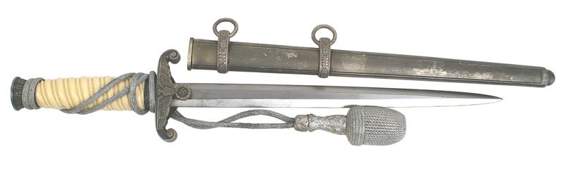 German WWII Army officer dagger: D-8 Army officer dagger. White grip with a dark patina on the silvered pommel, ferrule, crossguard and scabbard. Silver portopee in very good condition. Clean blade marked with the "PUMA" logo. II