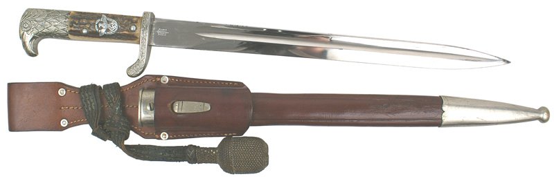 German WWII Police Gendarmerie dagger: D-19 Police Gendarmerie dress sidearm. Articulated nickeled feathered eagle head pommel and relief oak leaves crossguard. Reverse is stamped "L.D. 252". Metal Police eagle/swastika/wreath applied to t