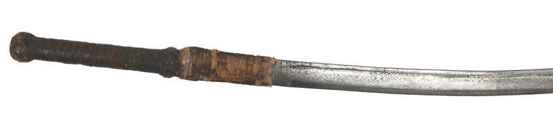 Russian Caucus shaska type sword blade: D-85 Russian Caucus shaska type sword blade. 30 1/2" curved blade with an etched continuous line of connected "diamond" panels holding floral designs. Unusual in that there is a shallow fuller and a 3
