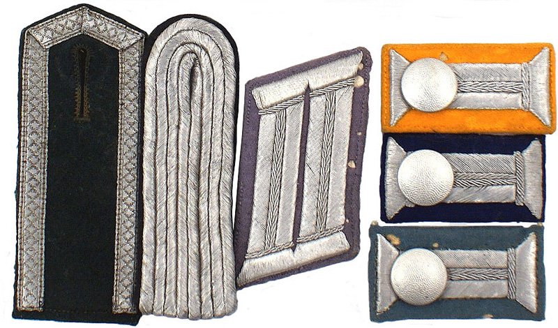 Lot of German WWII Army insignia collar tab: H-55 Lot of Army insignia: (1) Officer Propaganda Unit parade dress right collar tab (silver bullion on mouse gray). Several small moth holes. (2) Shoulder boards - officer Engineer and early pointed 