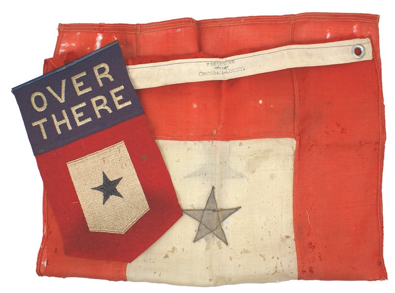 U.S. WWI Family member in Service felt pennant: H-181 "Family member in Service" felt window pennant. Embroidered blue star on a white shield with a red field - under "OVER THERE". 11 1/2" x 6 3/4". Very good condition. Also with a larger (31 1/2" 