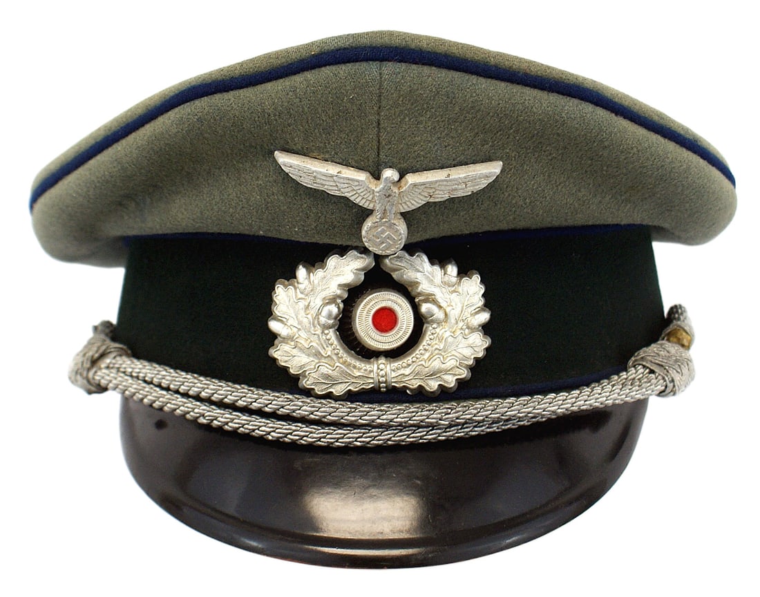 German WWII Army Medical peaked cap: E-117 German WWII Army Medical officer peaked cap. Quality wool with a dark green band and cornflower blue piping. Silver metal eagle/swastika and wreath/rosette. Silver chin cord. Black vulcan visor.