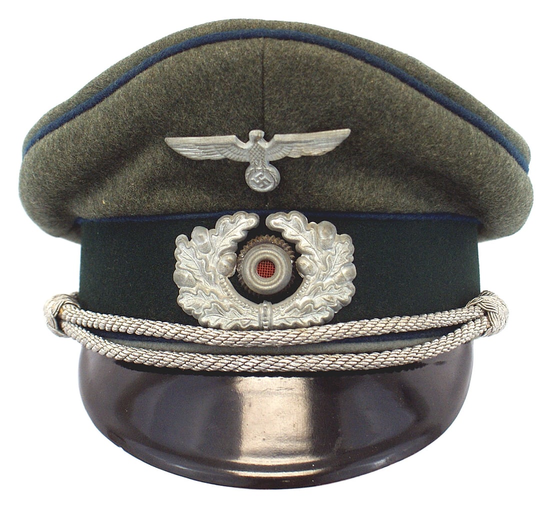 German WWII Army Medical peaked cap: E-119 German WWII Army Medical officer peaked cap. Wool "saddle shape" with a dark green band and cornflower blue piping. Aged silver metal eagle/swastika and wreath/rosette. Silver chin cord. Black v