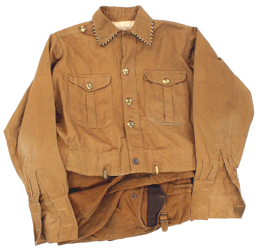 German WWII SA uniform: F-006 German Third-Reich SA uniform. Waist length "Brown shirt"/tunic with two chest pockets and domed gilt buttons. Black/white piped collar and the gilt buttons indicate the wearer was a member of a