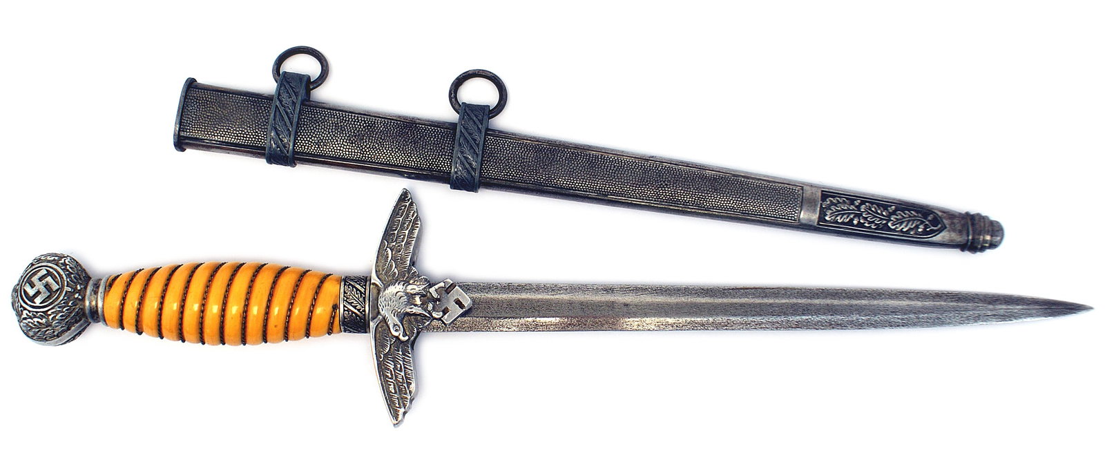German WWII Luftwaffe 2nd Model dagger: D-060 German WWII Luftwaffe 2nd Model Officer's dagger. Aluminum oval pommel bearing oak leaves and a swastika, oak leaf ferrule and flying eagle/swastika crossguard. Orange grip. 10" experimental Dam