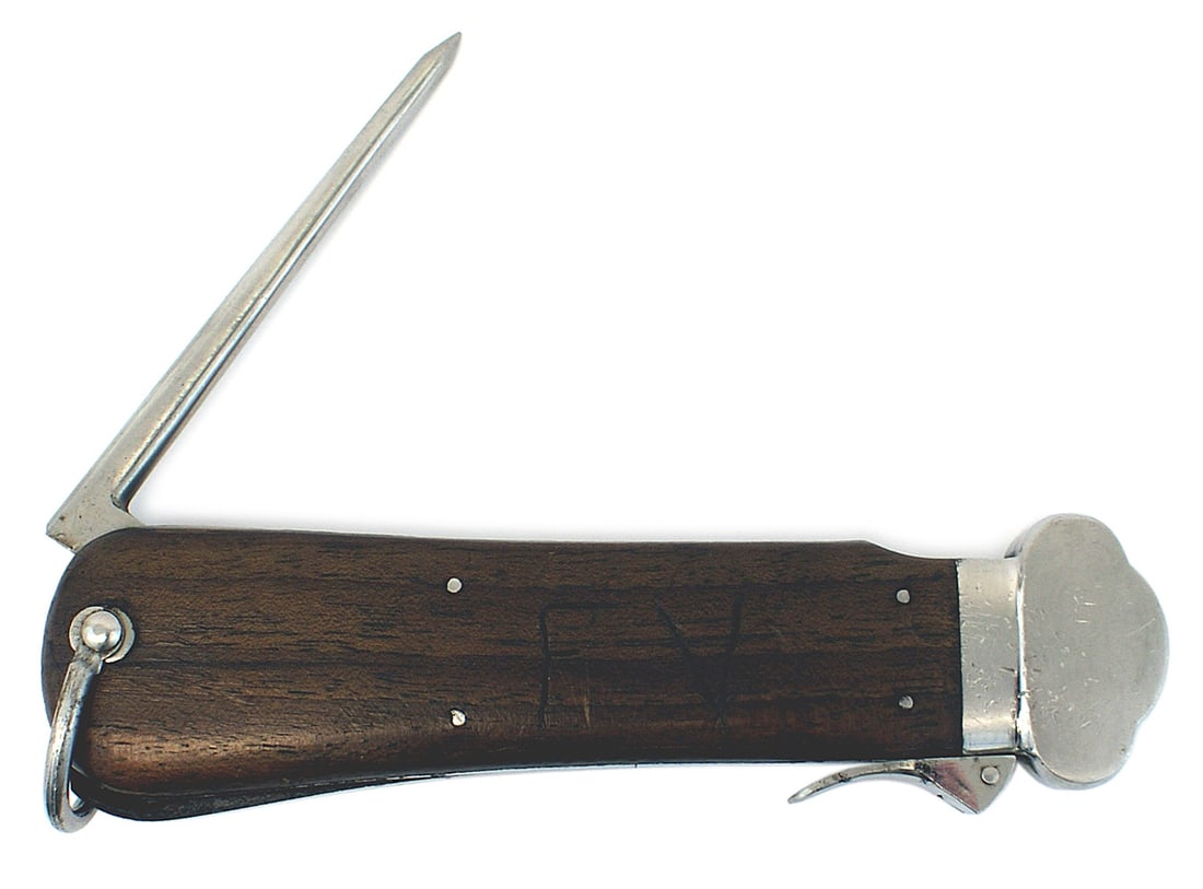 German WWII Luftwaffe paratrooper utility knife: D-076 German WWII Luftwaffe paratrooper utility knife. Pattern 1937 "Fallschirmjager - Schwerkraftmesser". Nickeled cap, locking lever, Marlin spike and swivel ring. "FV" scratched into the flat wood 