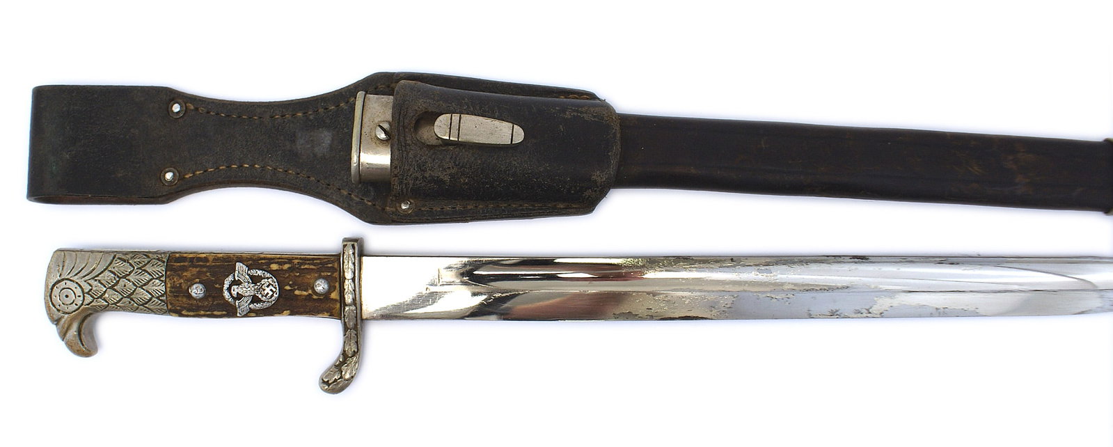 German WWII Police bayonet type sidearm: D-102 German WWII Police bayonet type sidearm. Nickeled feathered eagle head pommel with the simulated press stud acting as the eagle's eye. Metal Police eagle/swastika/wreath insignia affixed to the 