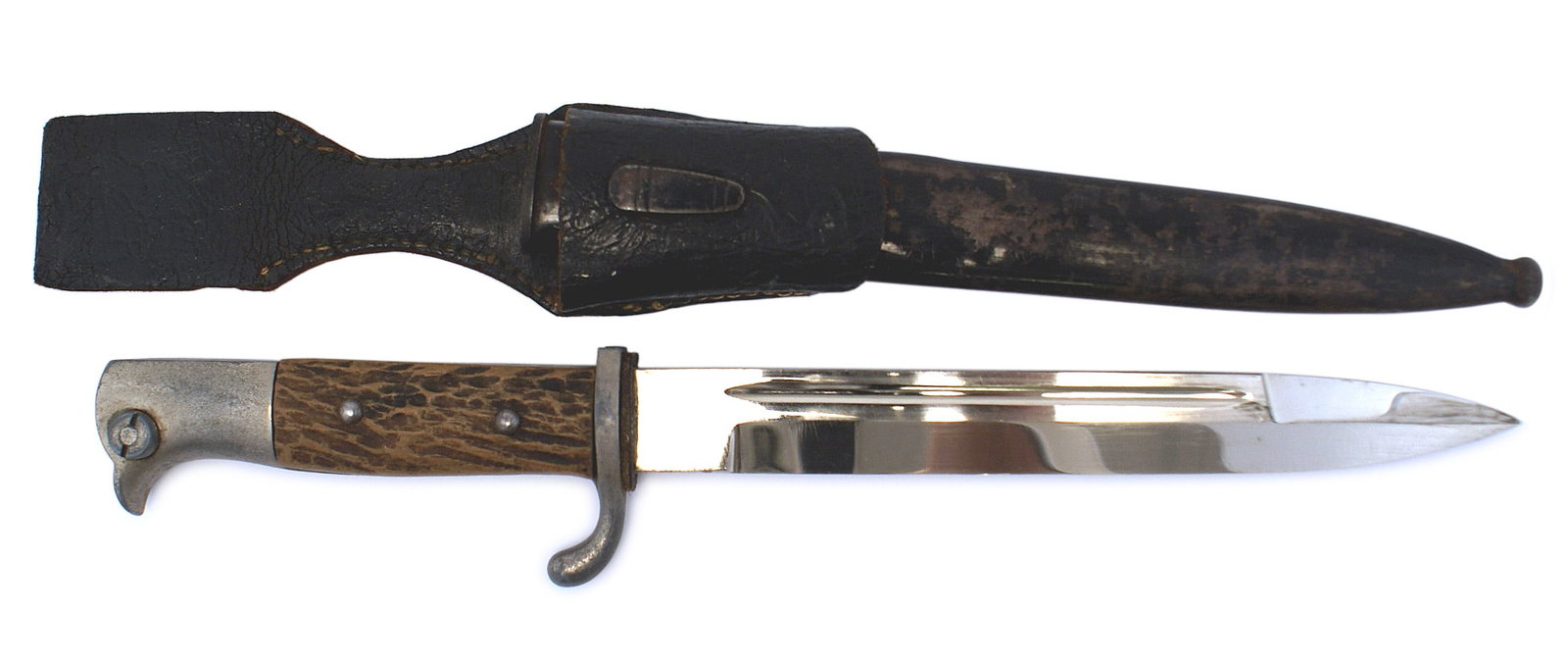 German WWII K-98 dress bayonet: D-135 German WWII K-98 dress bayonet. Minute age darkened bird-head pommel and short crossguard. Simulated grips. Clean 7 3/4" blade. Black enameled scabbard shows some wear and has one dent. Black dr