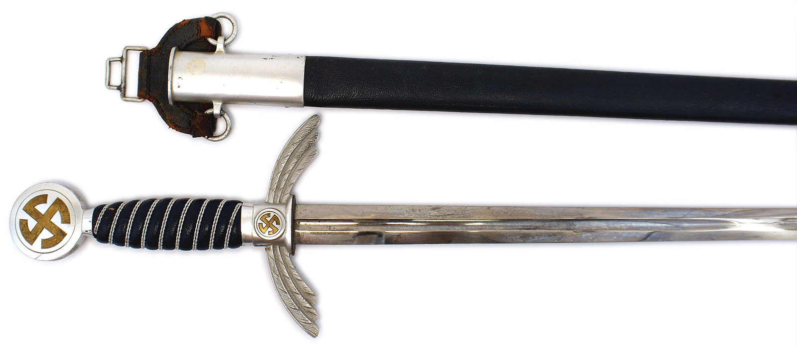 German WWII Luftwaffe officer dress sword: D-176 German Third-Reich Luftwaffe officer's dress sword. Age toned oak-leaf engraved aluminum roundel pommel holding an age toned sun-wheel swastika. Turned down aluminum feathered wings crossguard h