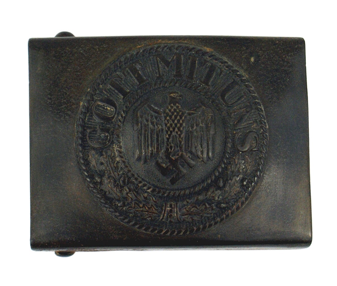 German Navy WWII EM belt buckle: H-007 German Navy WWII E.M. belt buckle. High relief eagle/swastika, "GOTT MIT UNS" and oak leaves. The original dark blue finish has age darkened to an almost black color. Stylized logo on reverse ap