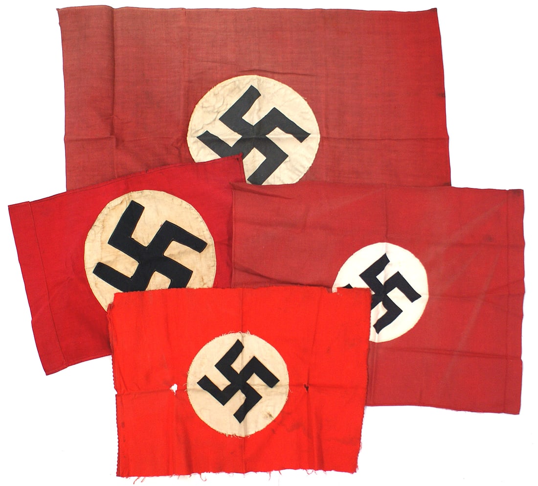 Lot of 4 small German WWII flags: H-085 Lot of 4 small Third-Reich Flags: (1) 18 1/2" x 27" printed swastika on 8 1/2" diameter disc. (2) Similar to above 15 1/2" x 20". With a pole sleeve. (3) Similar to above 12" x 17". Edging is wo