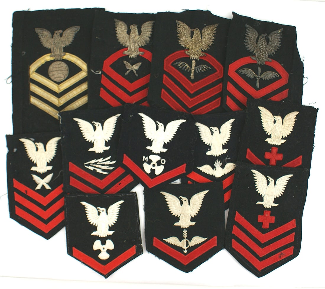 18 WWII US Navy rank specialist insignia: H-133 Lot of 18 WWII US Navy rank/specialist sleeve insignia: (1) Petty Officer Third Class (blue) - Aerographer, Engineering, with "MO" and with "M" within a "diamond". (2) Petty Officer's Second Cla