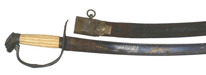 American War of 1812 period eagle head sword: K-4 American War of 1812 period eagle head sword. Darkened brass eagle head pommel and stylized reverse "D" knucklebow/crossguard. Reeded age-toned bone grip-one vertical separation. 30 1/4" curved bl