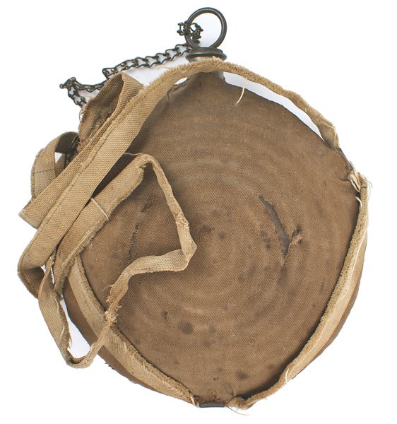 Civil War Union M1858 bull's eye canteen: K-35 Union M1858 "bull's eye" canteen. Neck is maker marked "ROHRMAN-PHILAD." With cork stopper and chain. Cover shows use-has some tears and a period sewn repair. Original tan shoulder strap shows we