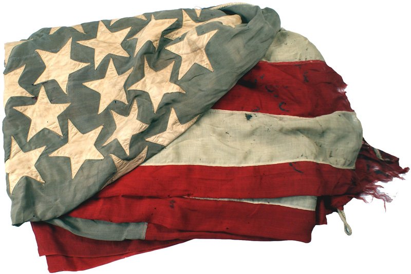 U.S. Civil War 35-star flag: K-45 Civil War 35-star flag. White stars are machine sewn in the configuration of an irregularly shaped 5-pointed star-a faded blue field. Red and white panels are separately sewn and also exhibit wea