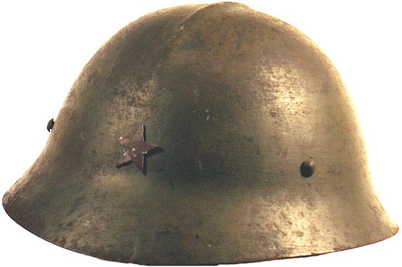 Japanese WWII Army variant helmet: E-54 Japanese WWII Army variant helmet. "Adrian" type top ridge, longer extended brim and 3-rivet liner band. 75% original green finish-shows wear. Star on front has browned from age. 3" x 3" section 